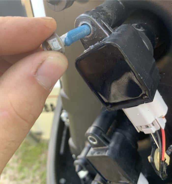Spark plug pulled from an outboard during a no-start diagnosis